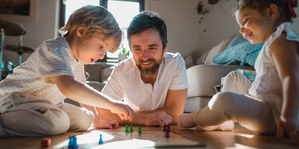 Father playing games with children